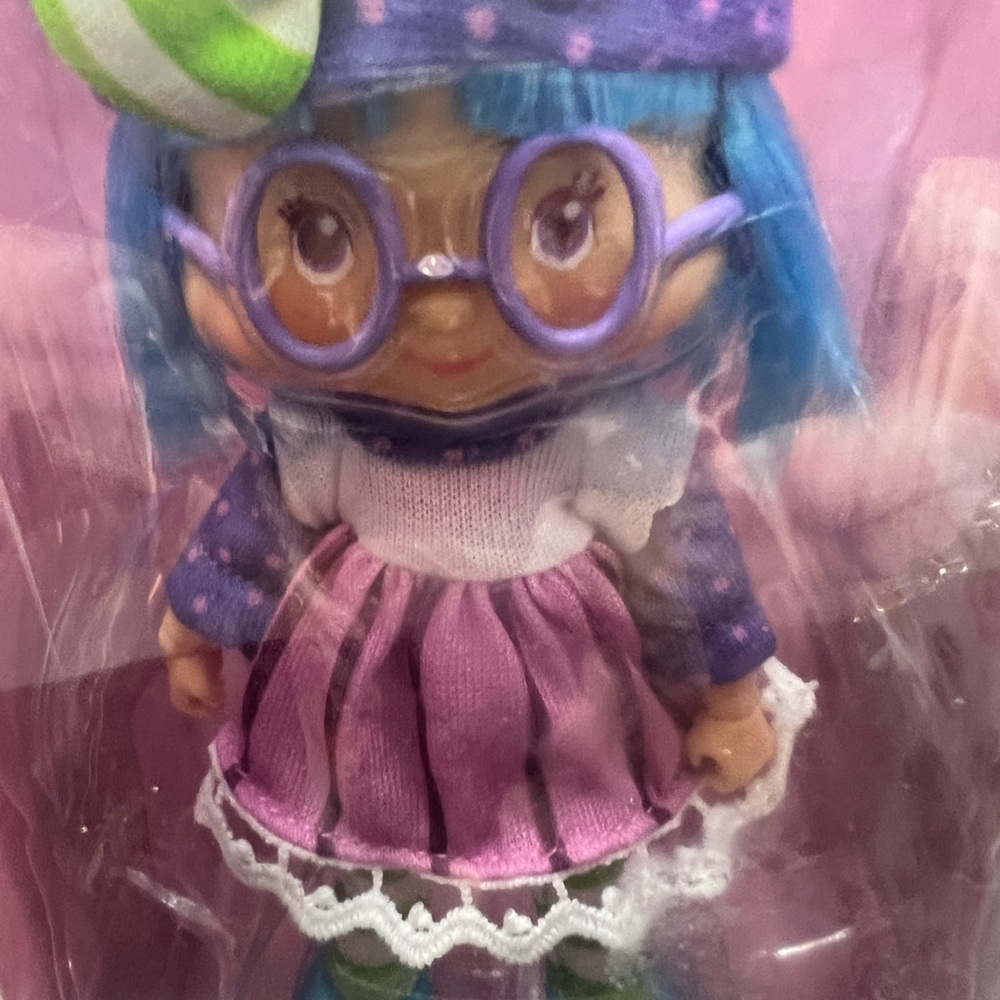 Colorful Doll with Blue Hair and Purple Outfit